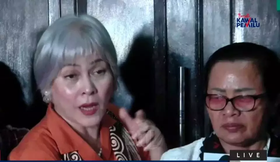 Legal activist Irma Hutabarat, left, speaks after the sentencing hearing of murder defendant Ferdy Sambo at the South Jakarta District Court on Feb. 13, 2023. (Videography)