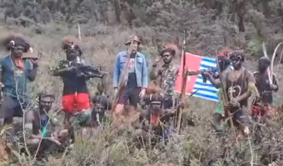 The screen capture shows a purported video of abducted New Zealand pilot Philips Max Marthin surrounded by Free Papua Movement (OPM) fighters. (Videography)