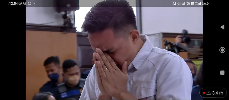 TV screen capture shows murder defendant Richard Eliezer weeping after the panel of judges sentenced him to 18 months in prison at the South Jakarta District Court on Feb. 15, 2023. (Stevani Wijaya)