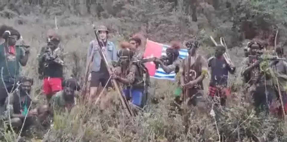 FILE - Susi Air pilot Phillip Mark Mehrtens surrounded by Free Papua Movement (OPM) fighters in a video released on Feb. 2023. (Videography)