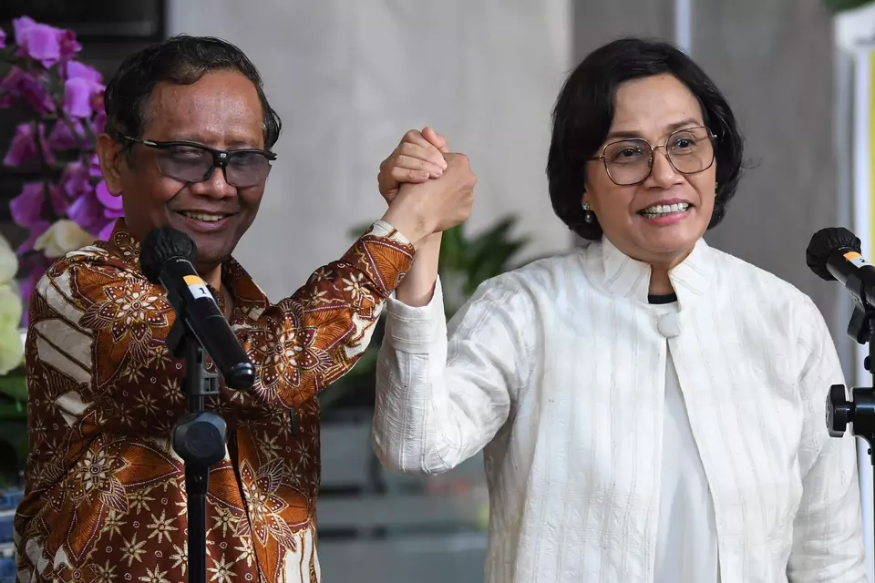 Coordinating Minister for Political, Legal, and Security Affairs Mohammad Mahfud MD, left, and Finance Minister Sri Mulyani Indrawati pose for a photo after a joint press conference in Jakarta on March 11, 2023. (Antara Photo/Aditya Pradana Putra)
