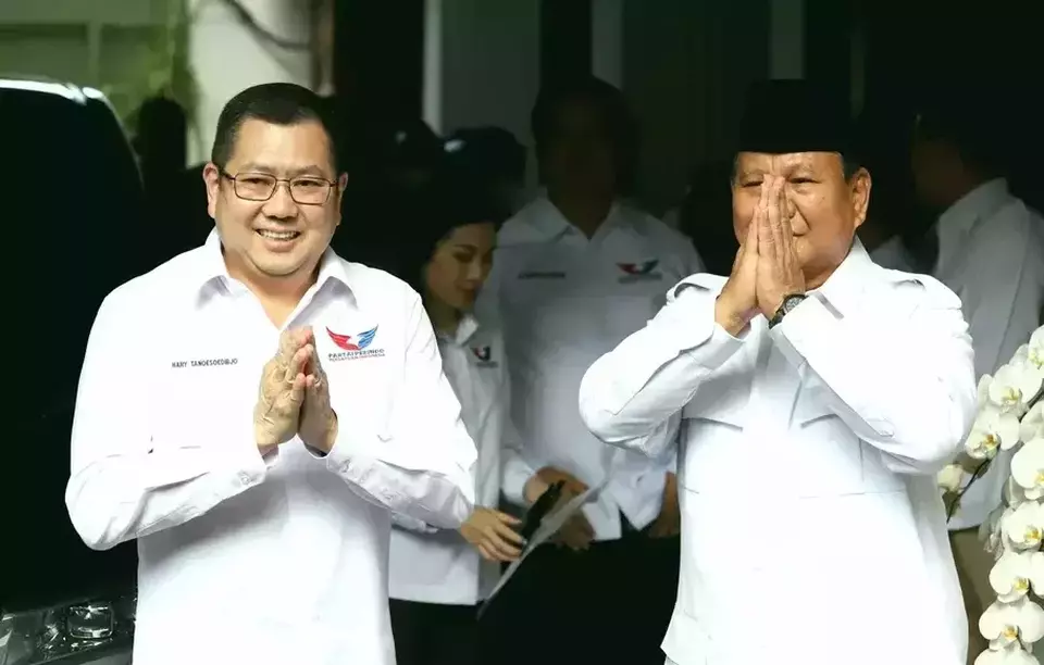 Great Indonesia Movement Party (Gerindra) Chairman Prabowo Subianto, right, and United Indonesia Party (Perindo) Chairman Hary Tanoesoedibjo greet reporters in Jakarta on April 5, 2023. (Joanito De Saojoao)