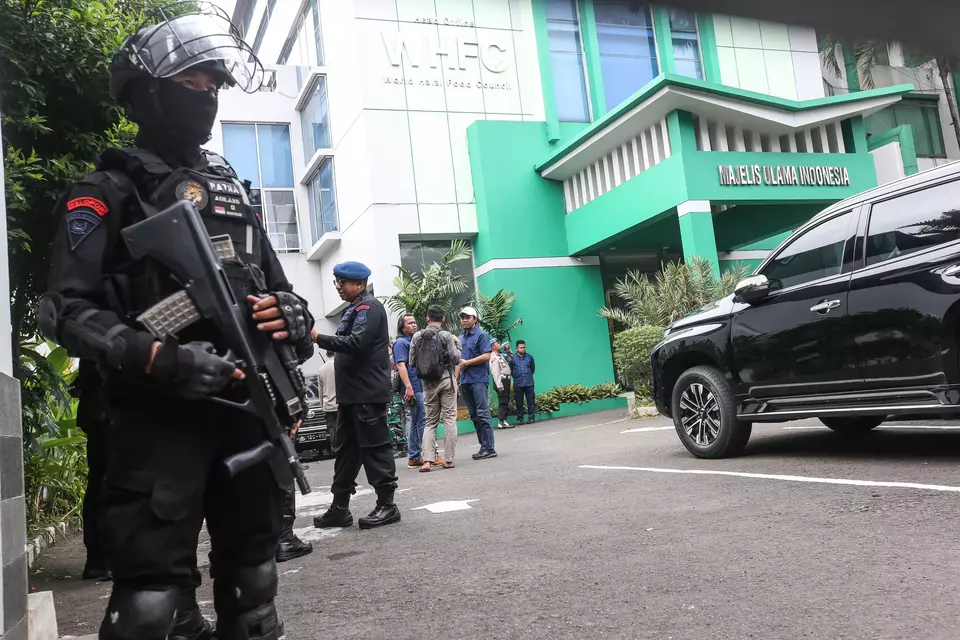 Members of the special police force Mobile Brigade (Brimob) stand guard in front of the  Indonesian Ulema Council (MUI) building in Jakarta after a shooting incident on May 2, 2023. (Antara photo)
