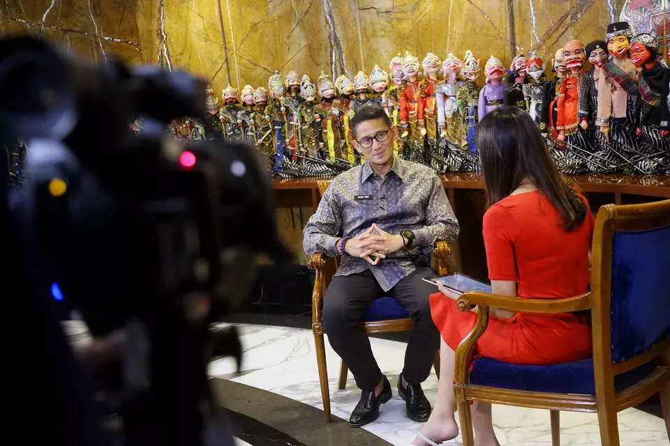 Tourism and Creative Economy Minister Sandiaga Uno, left, speaks in an interview with BTV at eL Hotel in Bandung, West Java, on May 27, 2023. (B-Universe Photo/Joanito De Saojoao)