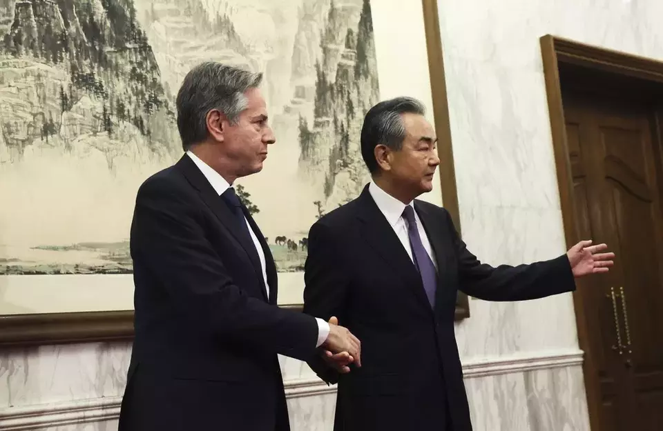 U.S. Secretary of State Antony Blinken, left, shakes hands with China's top diplomat Wang Yi at the Diaoyutai State Guesthouse in Beijing, China, Monday, June 19, 2023. (Leah Millis/Pool Photo via AP)