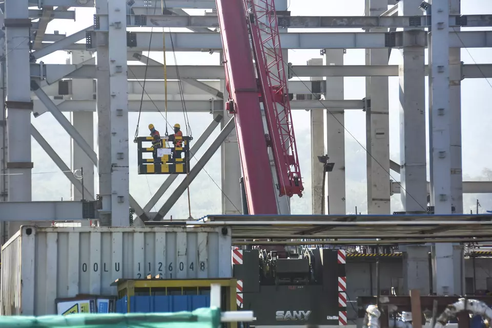 A construction hoist lifts workers at the smelter construction site operated by Amman Mineral Nusa Tenggara in West Sumbawa, West Nusa Tenggara, Tuesday, June 20, 2023. (Antara Photo/Ahmad Subaidi)