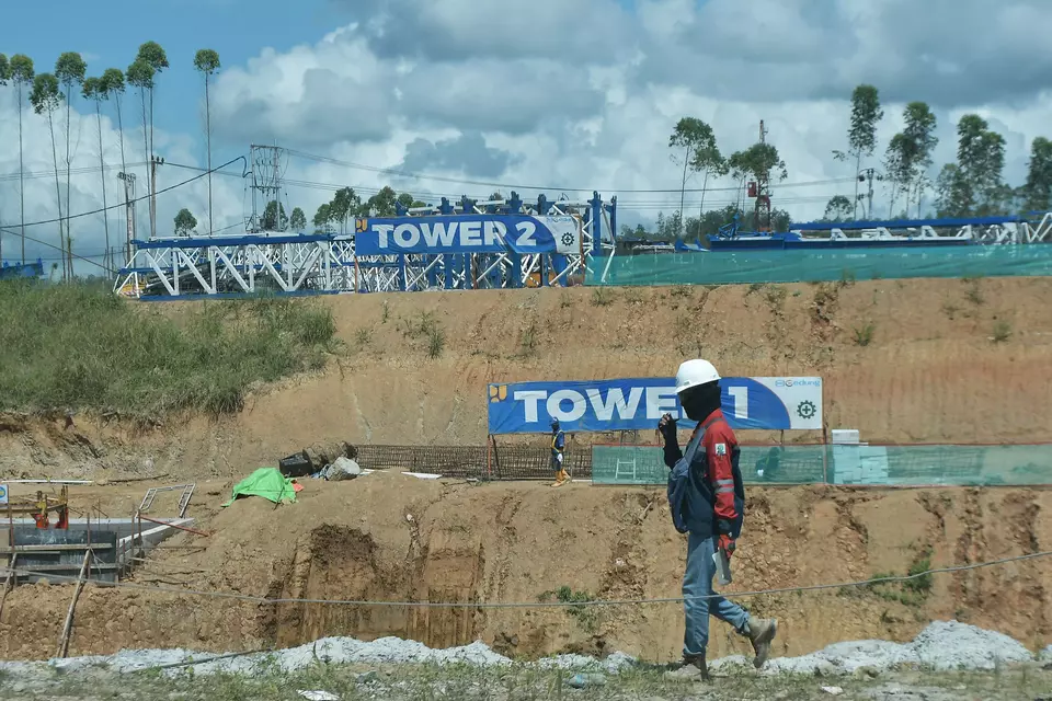 A construction worker walks in the middle of projects at the State Capital Nusantara in North Penajem Paser Regency, East Kalimantan, Thursday, June 8, 2023. (Antara Photo/Fakhri Hermansyah)