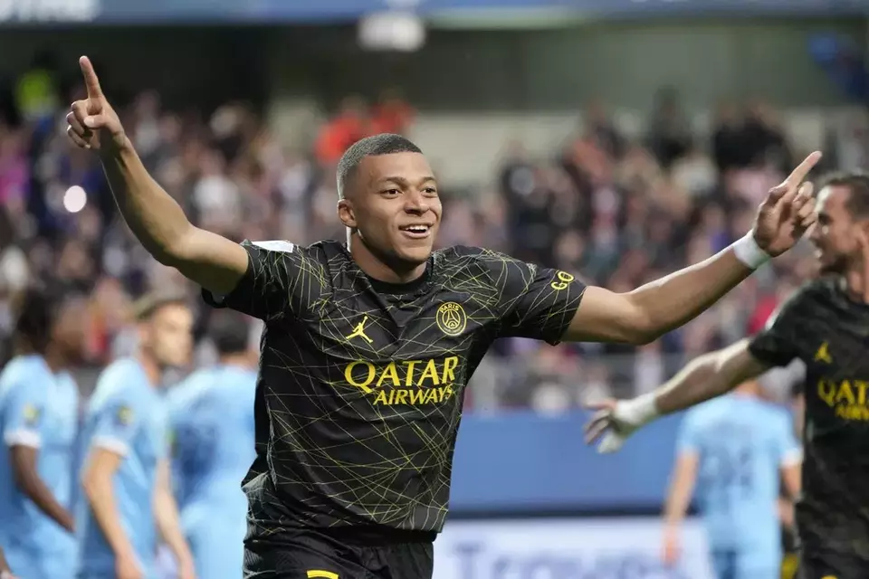 FILE - Paris Saint-Germain star Kylian Mbappe celebrates after scoring a goal during the French League One soccer match between Troyes and Paris Saint Germain, at the Stade de l'Aube, in Troyes, France, Sunday, May 7, 2023. (AP Photo/Lewis Joly, File)