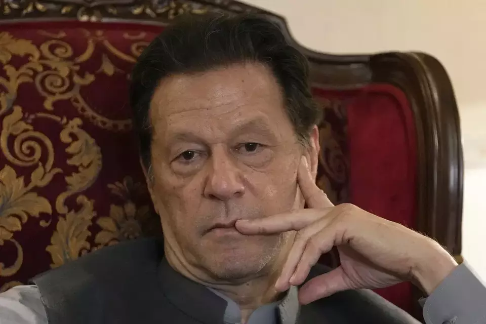 FILE - Pakistan s former prime minister Imran Khan listens to a member of media during talks with reporters regarding the current political situation and the ongoing cases against him at his residence, in Lahore, Pakistan, Thursday, Aug. 3, 2023. (AP Photo/K.M. Chaudary, File)