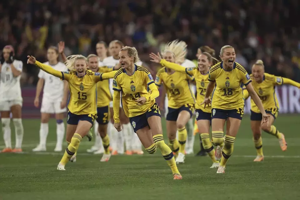 Swedish players celebrate after defeating the United States in a penalty shootout in their Women