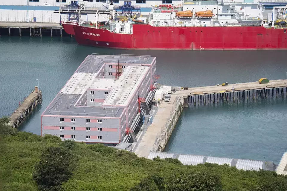 The Bibby Stockholm accommodation barge at Portland Port in Dorset, England, Tuesday August 1, 2023. The British Home Office have said around 50 asylum seekers would board the Bibby Stockholm, with the numbers rising to its maximum capacity over the coming months. (James Manning/PA via AP)