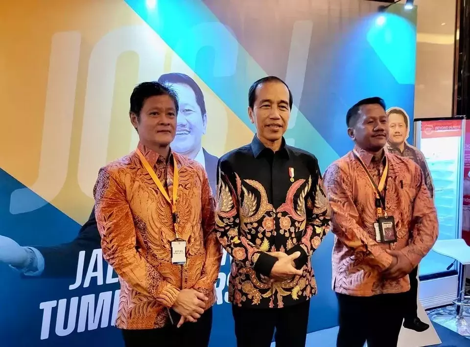 Real Estate Indonesia Chairman Joko Suranto, right, poses for a photo with President Joko Widodo, center, in this photo posted on his Facebook account on Aug. 9, 2023.