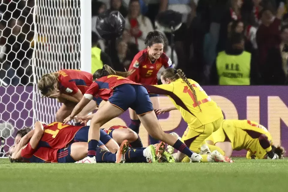 Spanish players celebrate as they defeated England after the Women's World Cup soccer final at Stadium Australia in Sydney, Australia, Sunday, Aug. 20, 2023. (AP Photo/Steve Markham)