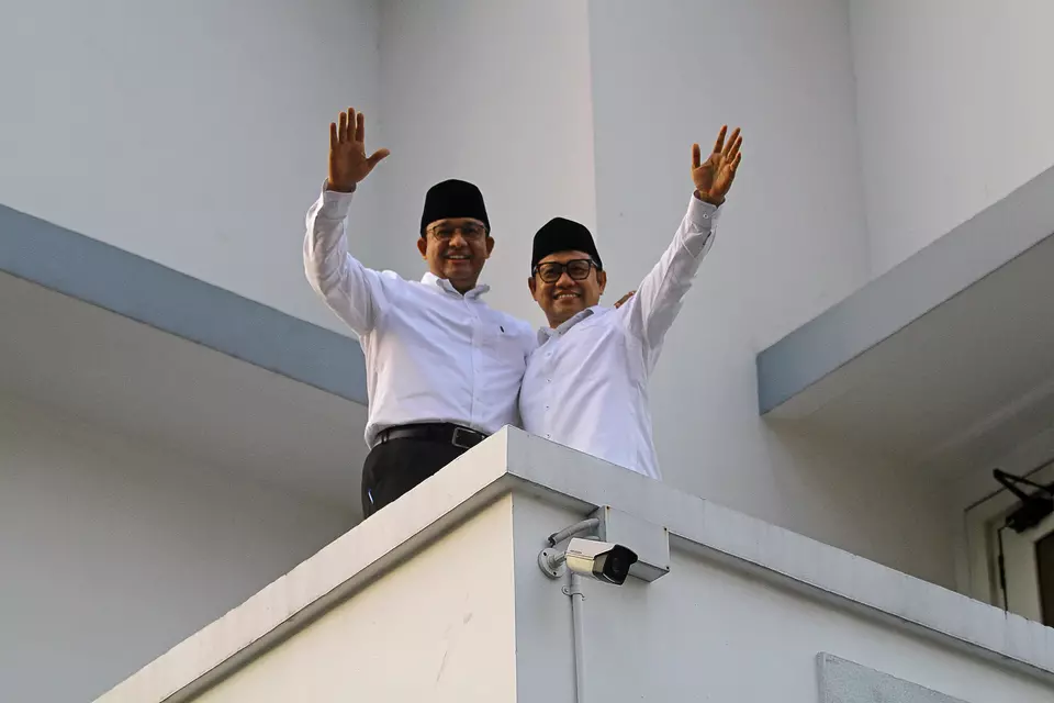 Presidential candidate Anies Baswedan, left, and newly-appointed running mate Muhaimin Iskandar greet their supporters at Majapahit Hotel in Surabaya, East Java, Saturday, Sept. 2, 2023. (Antara photo/Moch Asim)