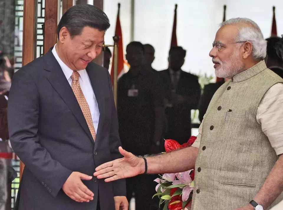 FILE- Indian Prime Minister Narendra Modi welcomes Chinese President Xi Jinping upon the latter s arrival at a hotel in Ahmadabad, India, Wednesday, Sept. 17, 2014. (AP Photo/Ajit Solanki, File)