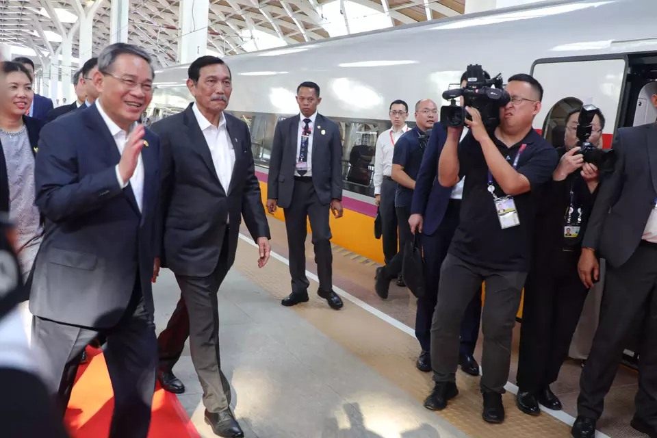Chinese Prime Minister Li Qiang, left, and Chief Investment Minister Luhut Binsar Pandjaitan, second left. walk into the Jakarta-Bandung high-speed train at the Halim Station in East Jakarta, Wednesday, Sept. 6, 2023. (Handout)