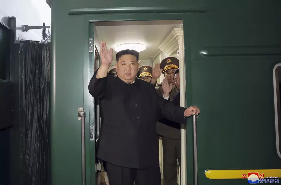 This Sept. 10, 2023 photo provided by the North Korean government shows that North Korean leader Kim Jong Un waves from a train in Pyongyang, North Korea, as he leaves for Russia. (Korean Central News Agency/Korea News Service via AP)