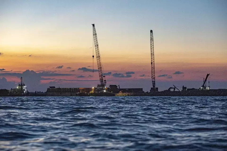 Construction equipment is used at the site of the port at the Kalimantan Industrial Park Indonesia (KIPI) in Mangkupadi, North Kalimantan, Indonesia on Thursday, Aug. 24, 2023. (AP Photo/Yusuf Wahil)