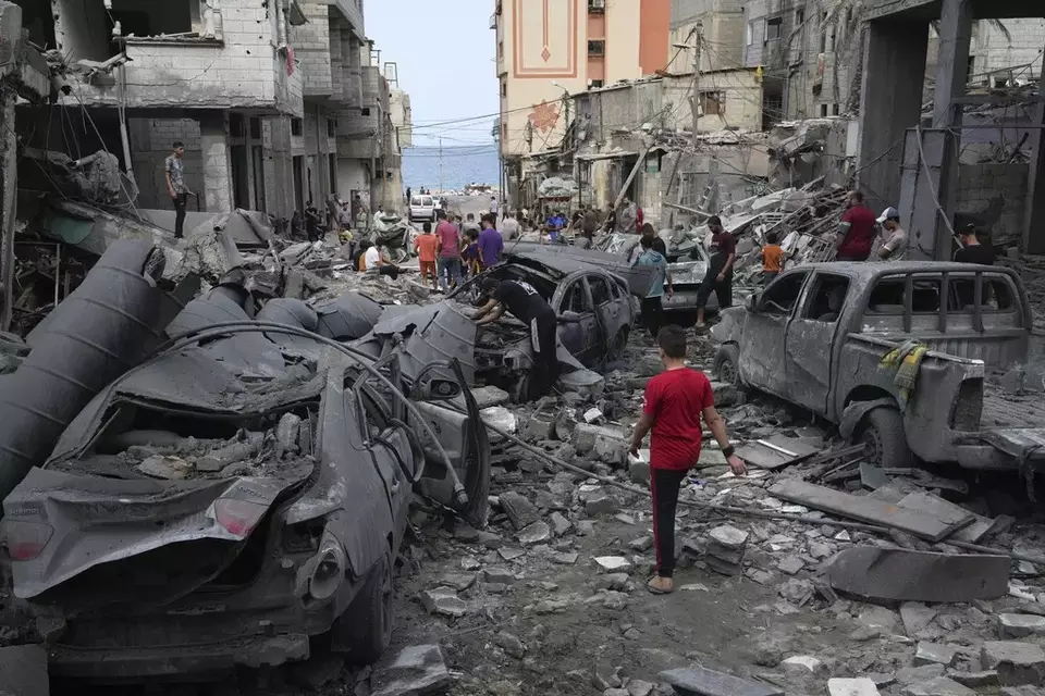 Palestinians inspect the rubble of the West mosque destroyed after it was hit by an Israeli airstrike at Shati refugee camp in Gaza City, early Monday, Oct. 9, 2023. (AP Photo/Adel Hana)