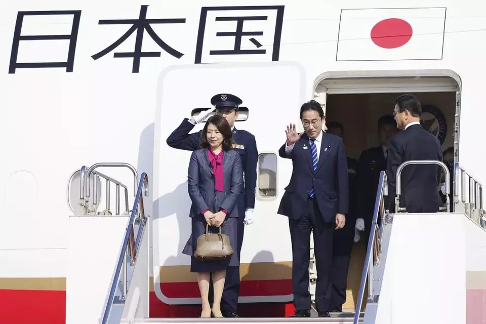 Japanese Prime Minister Fumio Kishida, center, and his wife Yuko prepare to leave Haneda airport in Tokyo, Friday, Nov. 3, 2023. (Kyodo News via AP)