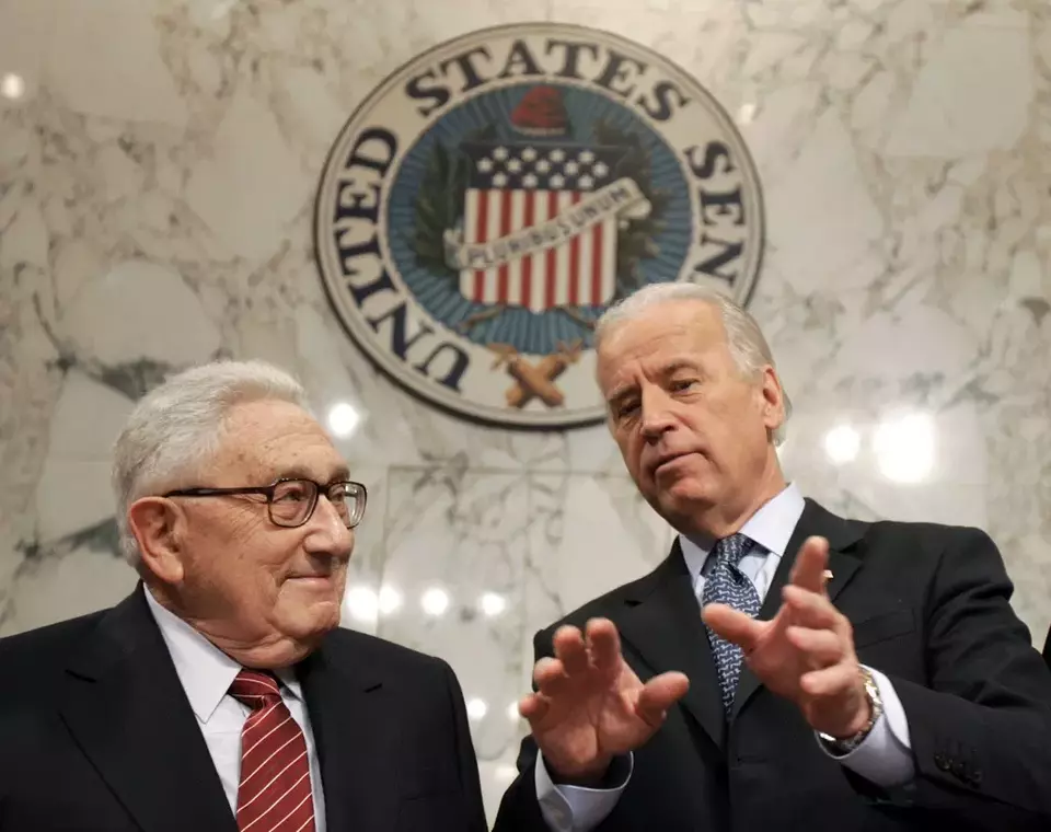 FILE - Former Secretary of State Henry Kissinger, left, talks with Senate Foreign Relations Committee Chairman Sen. Joseph Biden, D-Del., on Capitol Hill in Washington, Jan. 31, 2007, prior to Kissinger testifying before the committee about Iraq. (AP Photo/Susan Walsh, File)