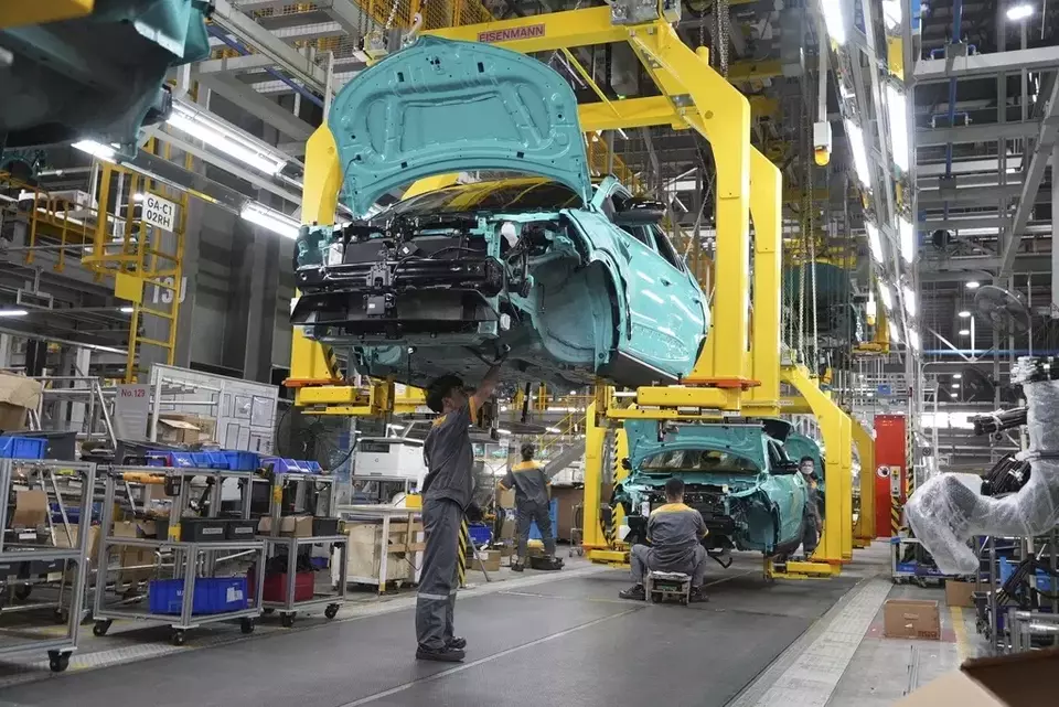 FILE - Workers assemble electric cars at a Vinfast factory in Hai Phong, Vietnam, on Sept. 29, 2023. (AP Photo/Hau Dinh)