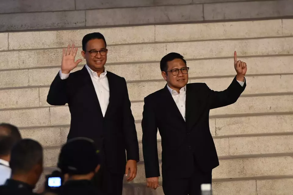 Presidential candidate Anies Baswedan, left, and his running mate Muhaimin Iskandar arrive at the Istora Sports Stadium in Jakarta to join the presidential debate, Sunday, Jan. 7, 2024. (Antara Photo/Fakhri Hermansyah)