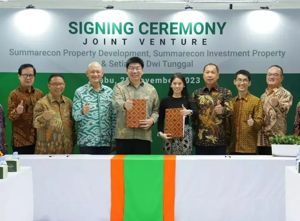 SouthCity and Summarecon Agung executives pose for a photo after the signing of a joint venture agreement in Jakarta on Nov. 29, 2023. (Handout)