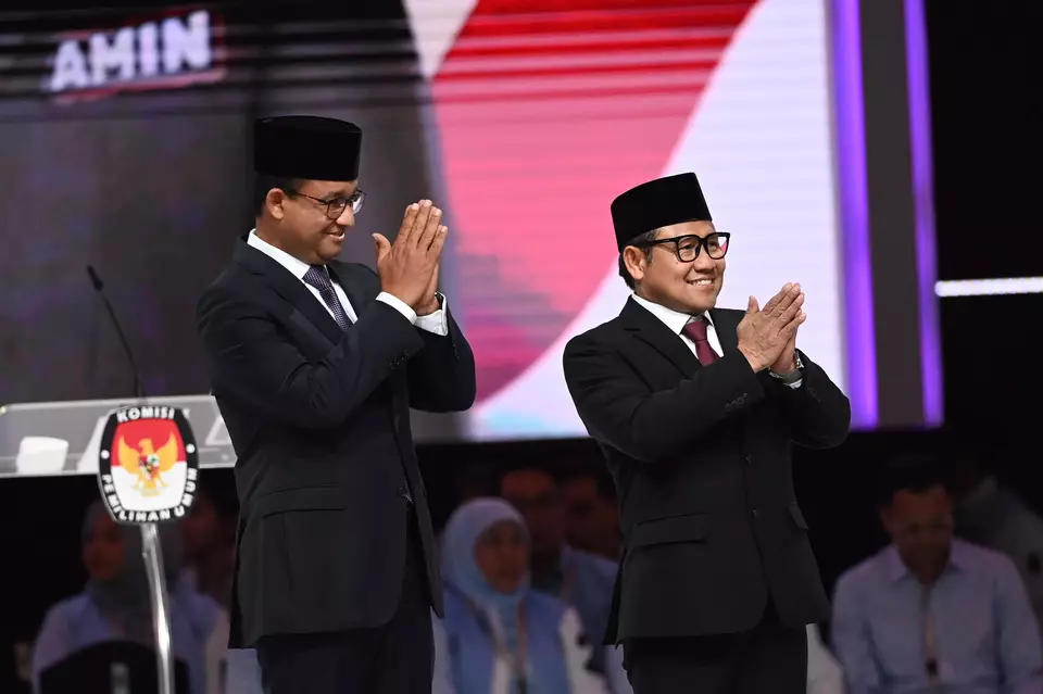 Presidential candidate Anies Baswedan, left, and running mate Muhaimin Iskandar greet the audience on the debate stage at the Jakarta Convention Center, Sunday, Feb. 4, 2024. (Antara Photo/Aditya Pradana Putra)