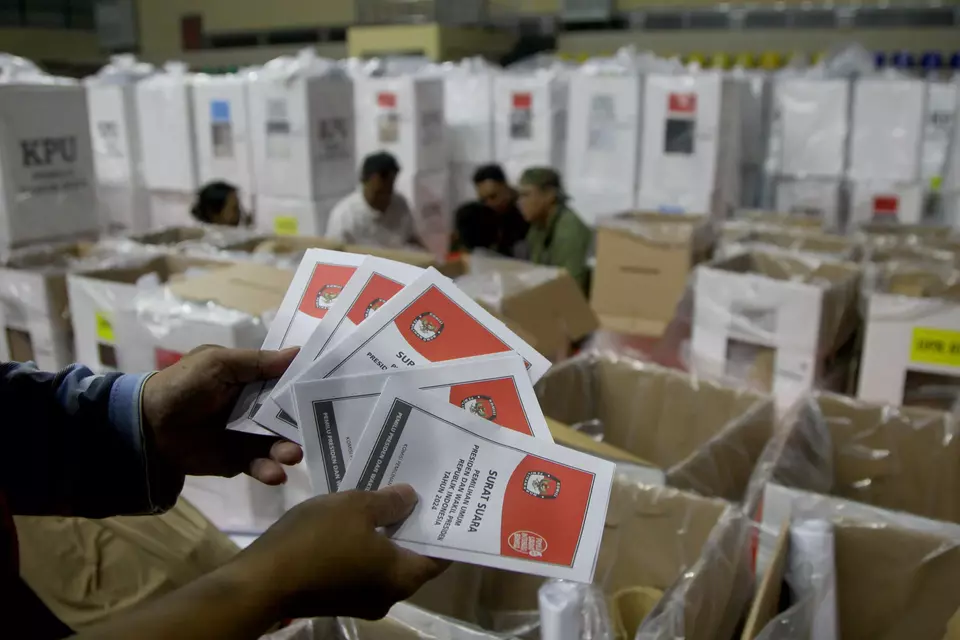 An official shows ballot papers at a makeshift storage for election logistics in Cempaka Putih Stadium, East Jakarta, Tuesday, Feb. 6, 2024. (B-Universe Photo/Joanito De Saojoao)