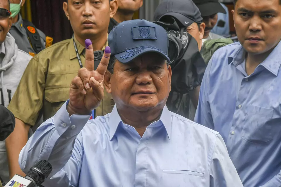 Presidential candidate Prabowo Subianto shows his fingers with election ink in Bojong Koneng, Bogor, on February 14, 2024. (Antara Photo/Galih Pradipta)