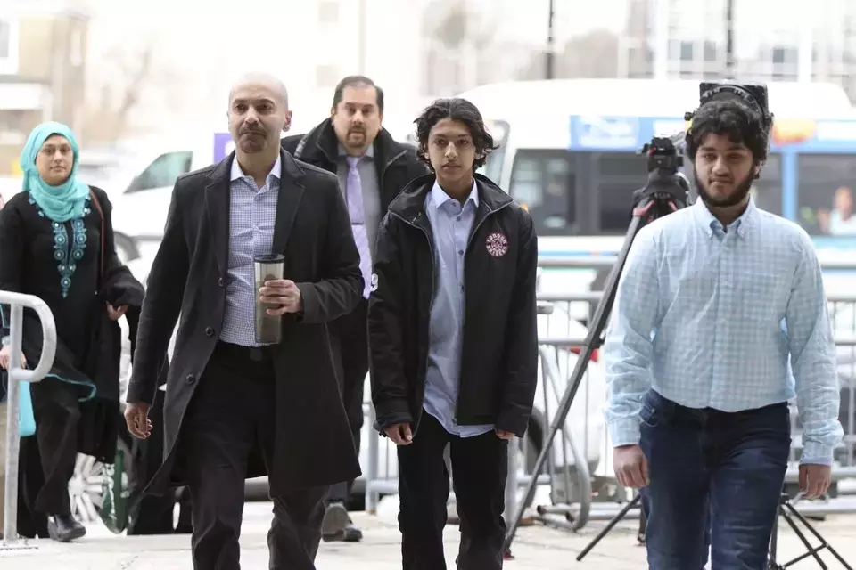 Supporters of the Afzaal family arrive at a courthouse to attend the sentencing hearing of Nathaniel Veltman in London, Ontario, Thursday, Feb. 22, 2024. (Nicole Osborne /The Canadian Press via AP)