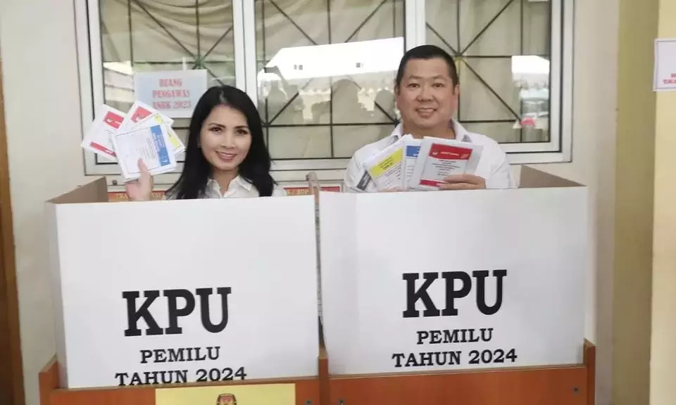 United Indonesia Party (Perindo) Chairman Hary Tanoesoedibjo, right, and his wife Liliana Tanoesoedibjo pose for a photo after casting their ballots in Jakarta, Wednesday, Feb. 14, 2024. (Photo courtesy of Perindo)