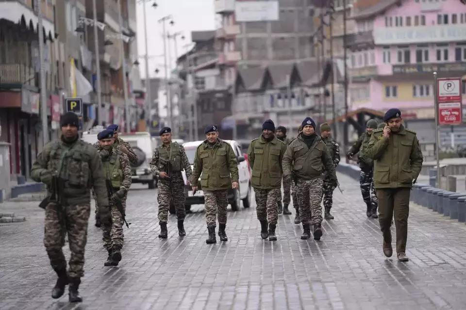 FILE - Paramilitary officers patrol at a market ahead of Indian Prime Minister Narendra Modi addressing a public rally in Srinagar, Indian-controlled Kashmir, Thursday, March 7, 2024. (AP Photo/Mukhtar Khan)