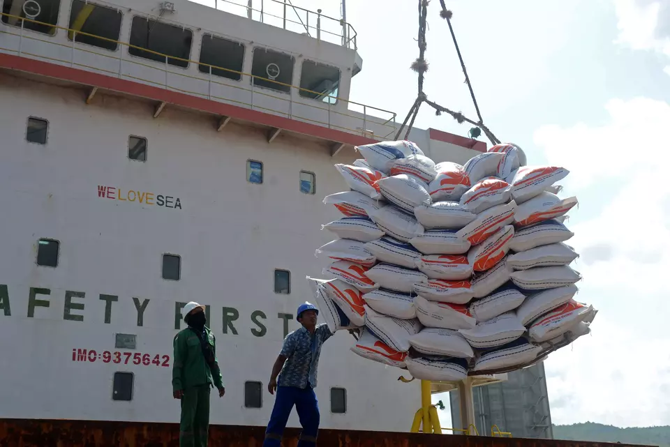 FILE - Workers unload sacks of imported Thai rice from a cargo ship at Malahayati Port in Aceh, Friday, March 1, 2024. (Antara Photo)
