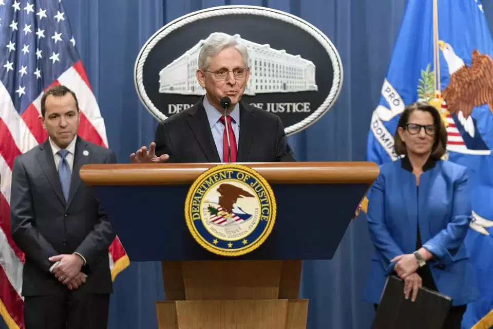 US Attorney General Merrick Garland accompanied by New Jersey Attorney General Matthew Platkin and Deputy Attorney General Lisa Monaco, speaks during a news conference at the Department of Justice headquarters in Washington, Thursday, March 21, 2024. (AP Photo/Jose Luis Magana)