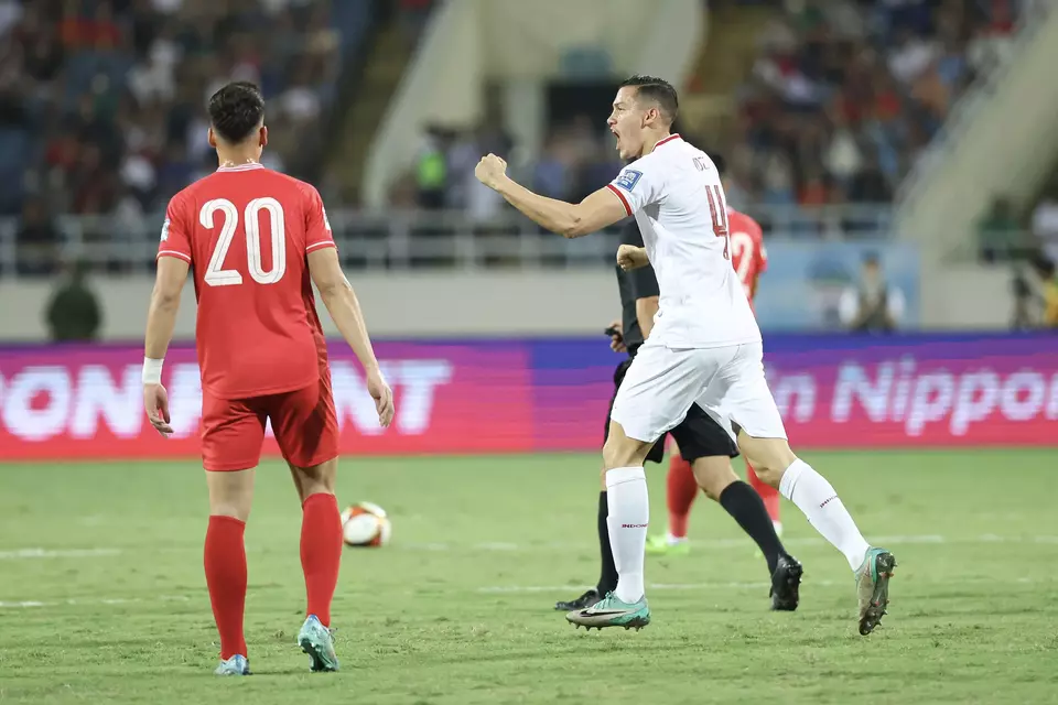 Dutch-born footballer Jay Noah Idzes, right, celebrates after scoring a goal for the Indonesian national team in the World Cup qualifier against Vietnam at My Dinh Stadium in Hanoi, Tuesday, March 26, 2024. (Photo courtesy of PSSI)