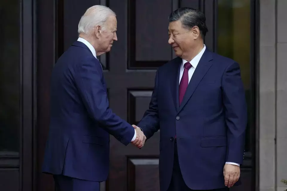 FILE - US President Joe Biden greets his Chinese counterpart Xi Jinping at the Filoli Estate in Woodside, California, Nov. 15, 2023, on the sidelines of the Asia-Pacific Economic Cooperative conference. (Doug Mills/The New York Times via AP, Pool, File)