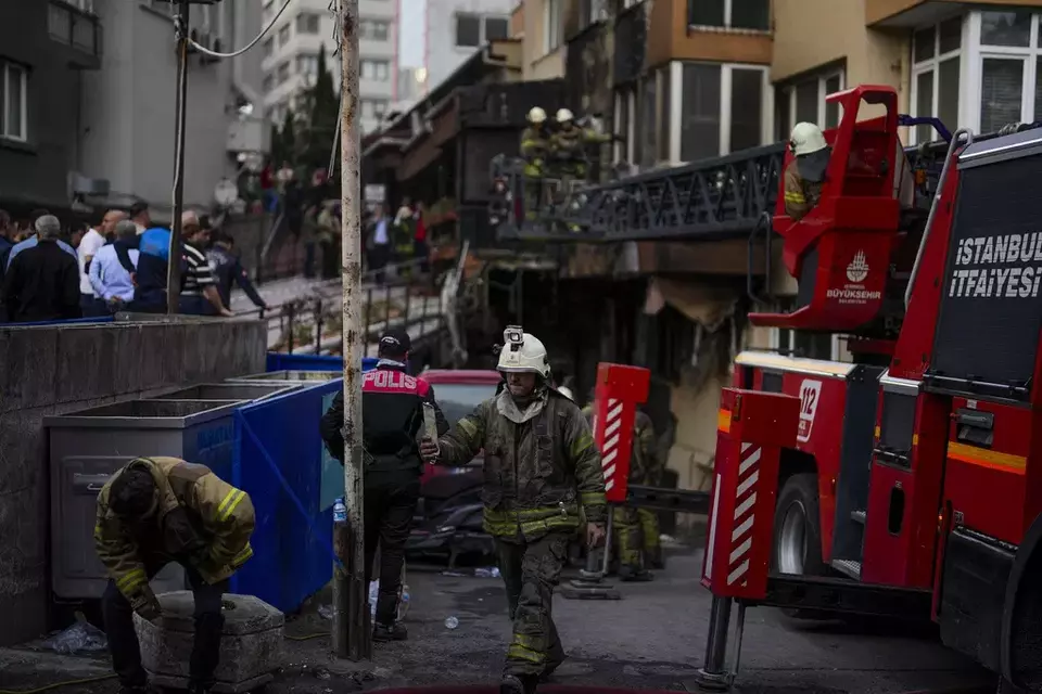 Firefighters and emergency teams work in the aftermath of a fire that broke out during daytime in a nightclub in Istanbul, Turkey, Tuesday, April 2, 2024.(AP Photo/Khalil Hamra)