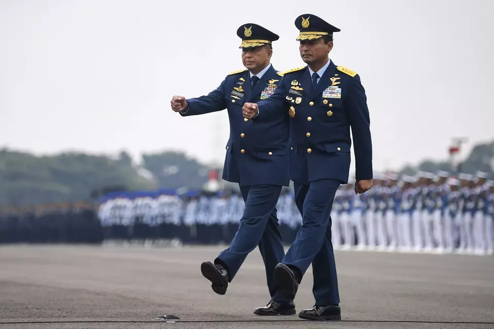 Newly-installed Air Force Chief of Staff Mohamad Tonny Harjono, right, walks beside his predecessor Fadjar Prasetyo during the handover ceremony at Halim Perdanakusuma Air Force Base in Jakarta, Friday, April 5, 2024. (Antara Photo/M Risyal Hidayat)