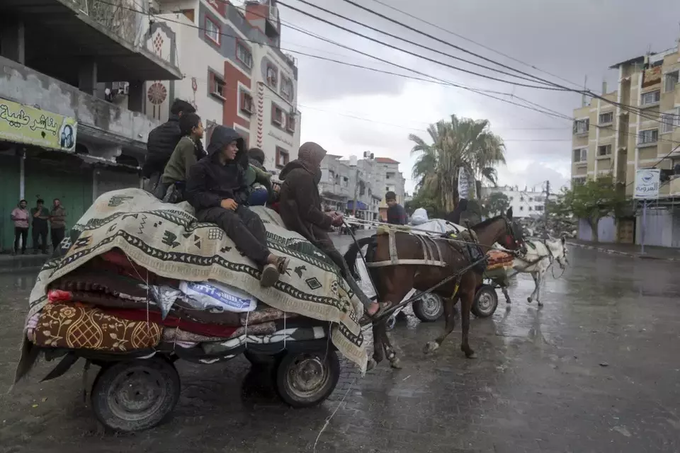 Palestinians flee from the eastern side of the southern Gaza city of Rafah after the Israeli army orders them to evacuate ahead of a military operation, in Rafah, Gaza Strip, Monday, May 6, 2024. The order affects tens of thousands of people and could signal a broader invasion of Rafah, which Israel has identified as Hamas' last major stronghold after seven months of war. (AP Photo/Ismael Abu Dayyah)	