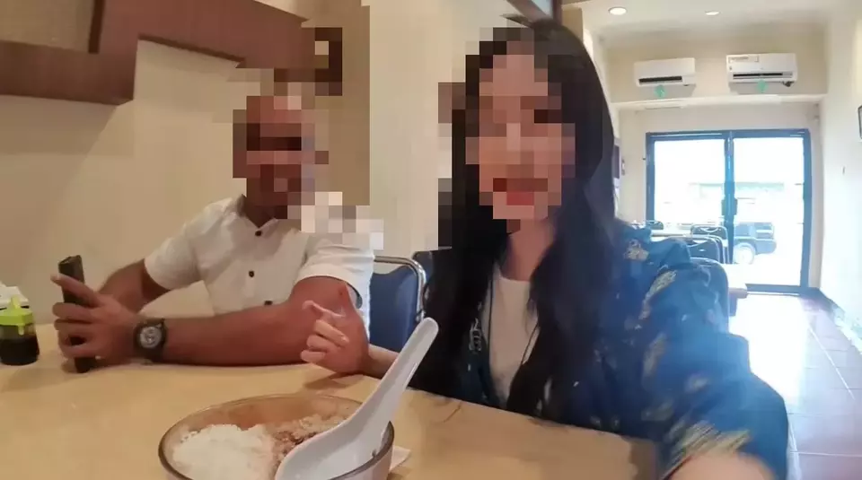 South Korean YouTuber Jiah (right) is seen vlogging in Manado, North Sulawesi, in a screenshot from her video posted on May 5, 2024. Asri Damuna, the Head of the Sangia Nibandera Airport Office, is pictured beside her. Asri is currently under investigation by the Ministry of Transportation for allegedly harassing Jiah. (YouTube: Jiah)