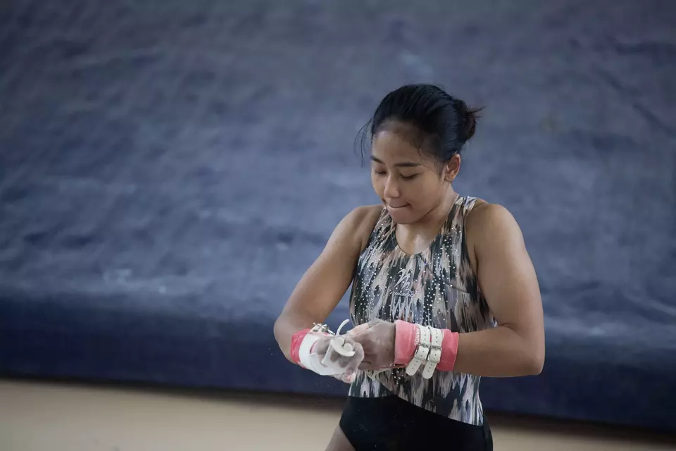 Gymnast Rifda Irfanaluthfi prepares for training on uneven bars at Raden Inten Indoor Stadium in East Jakarta, Monday, April 22, 2024. Rifda is the only Indonesian gymnast to qualify for the Paris Olympics. (Antara Photo/Wahyu Putro)
