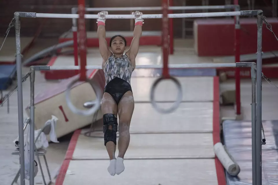 Gymnast Rifda Irfanaluthfi trains on uneven bars at Raden Inten Indoor Stadium in East Jakarta, Monday, April 22, 2024. Rifda is the only Indonesian gymnast to qualify for the Paris Olympics. (Antara Photo/Wahyu Putro)