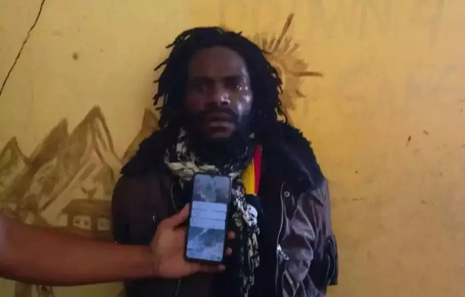 Anan Nawipa, a suspected member of the Free Papua Movement (OPM), is interrogated by police in Paniai, Papua, Saturday, May 11, 2024. (Photo courtesy of the Papua Police)
