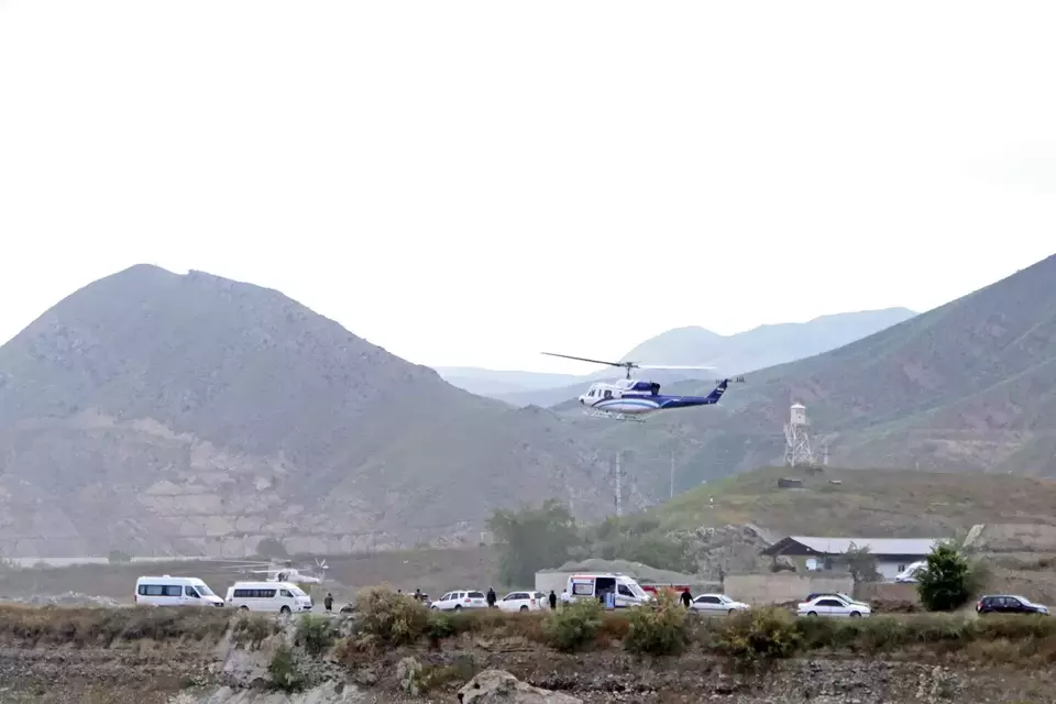The helicopter carrying Iranian President Ebrahim Raisi takes off at the Iranian border with Azerbaijan after President Raisi and his Azeri counterpart Ilham Aliye inaugurated the dam of Qiz Qalasi, or Castel of Girl in Azeri, Iran, Sunday, May 19, 2024. (IRNA via AP)