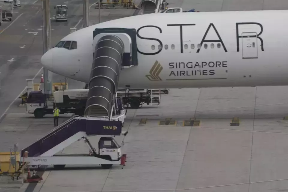 The Boeing 777-300ER aircraft of Singapore Airlines is parked after the SQ321 London-Singapore flight, that encountered severe turbulence, at Suvarnabhumi International Airport, near Bangkok, Thailand, Wednesday, May 22, 2024. (AP Photo/Sakchai Lalit)