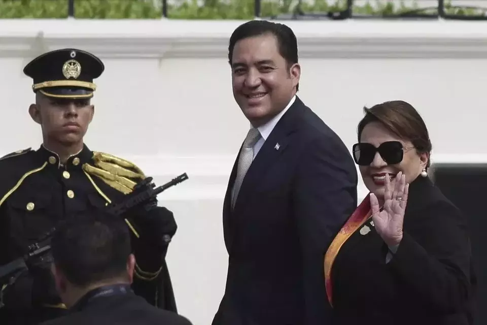 President of Honduras Xiomara Castro waves as she arrives to attend President Nayib Bukele