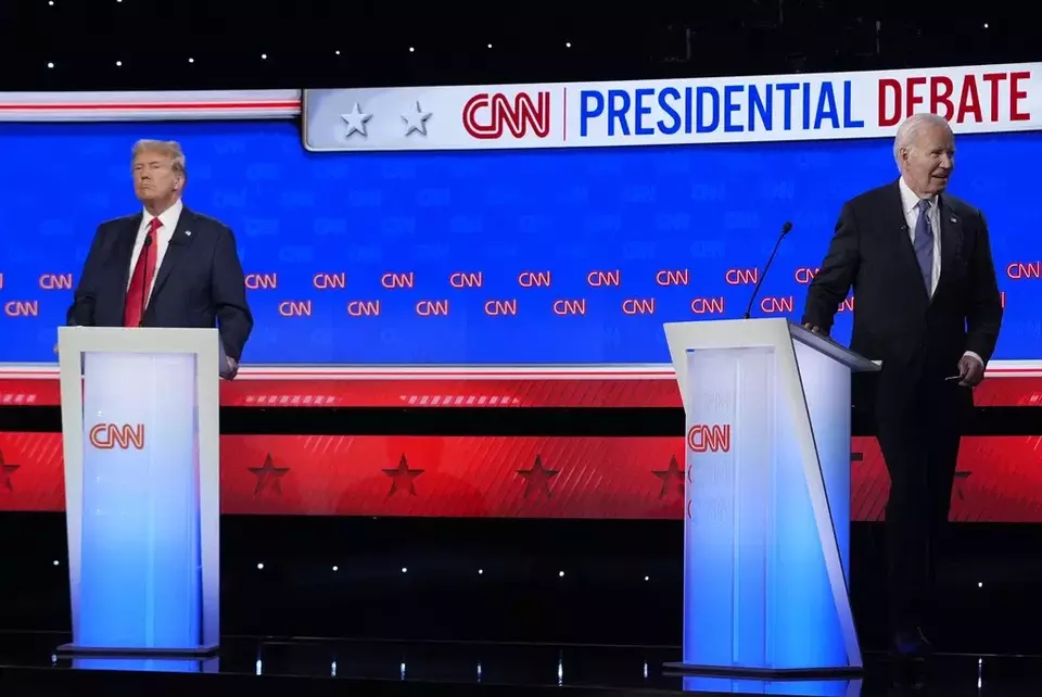 President Joe Biden, right, walks off stage as Republican presidential candidate former President Donald Trump stands at the conclusion of a presidential debate hosted by CNN, Thursday, June 27, 2024, in Atlanta. (AP Photo/Gerald Herbert)