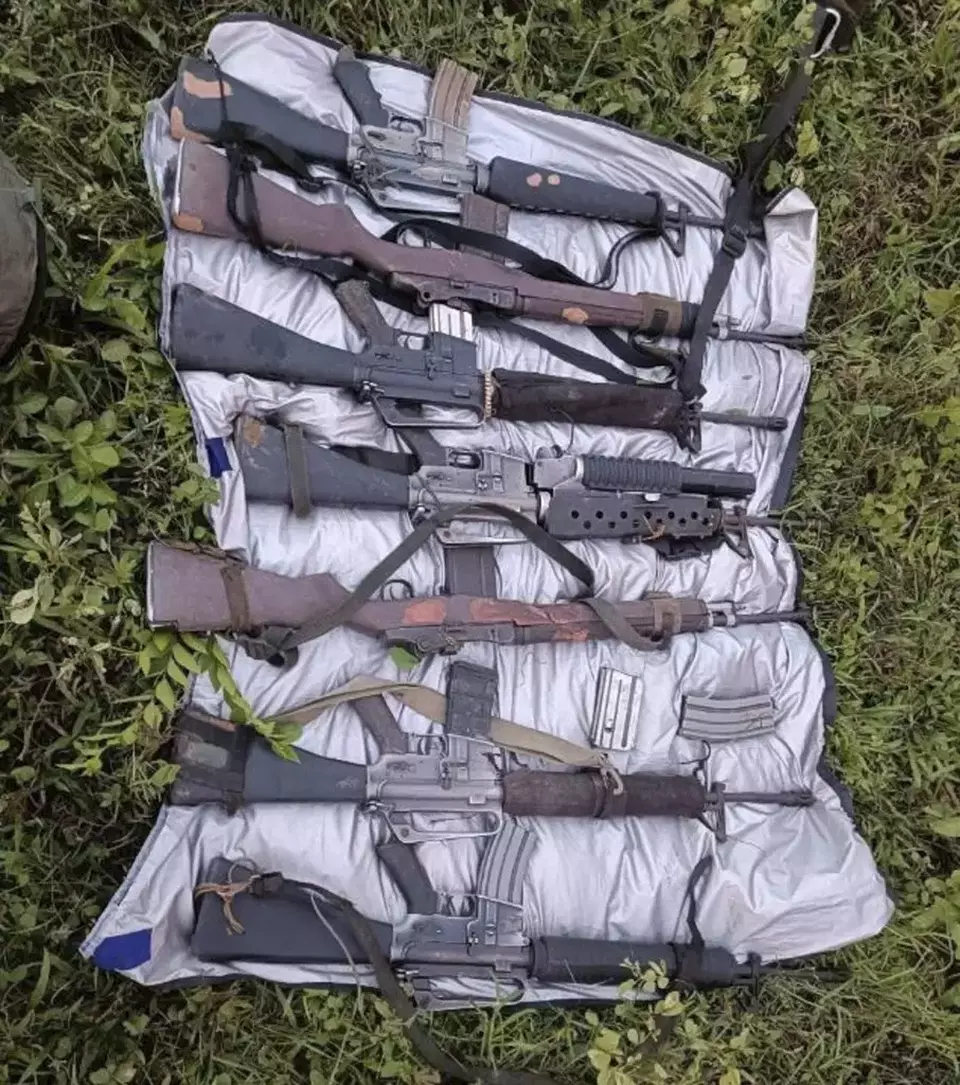 In this handout photo provided by the Armed Forces of the Philippines Public Affairs Office, guns recovered from suspected communist rebels are placed together after an encounter with Philippine troops near a village in Pantabangan town in Nueva Ecija province, Philippines Wednesday June 26, 2024. (Armed Forces of the Philippines Public Affairs Office via AP)